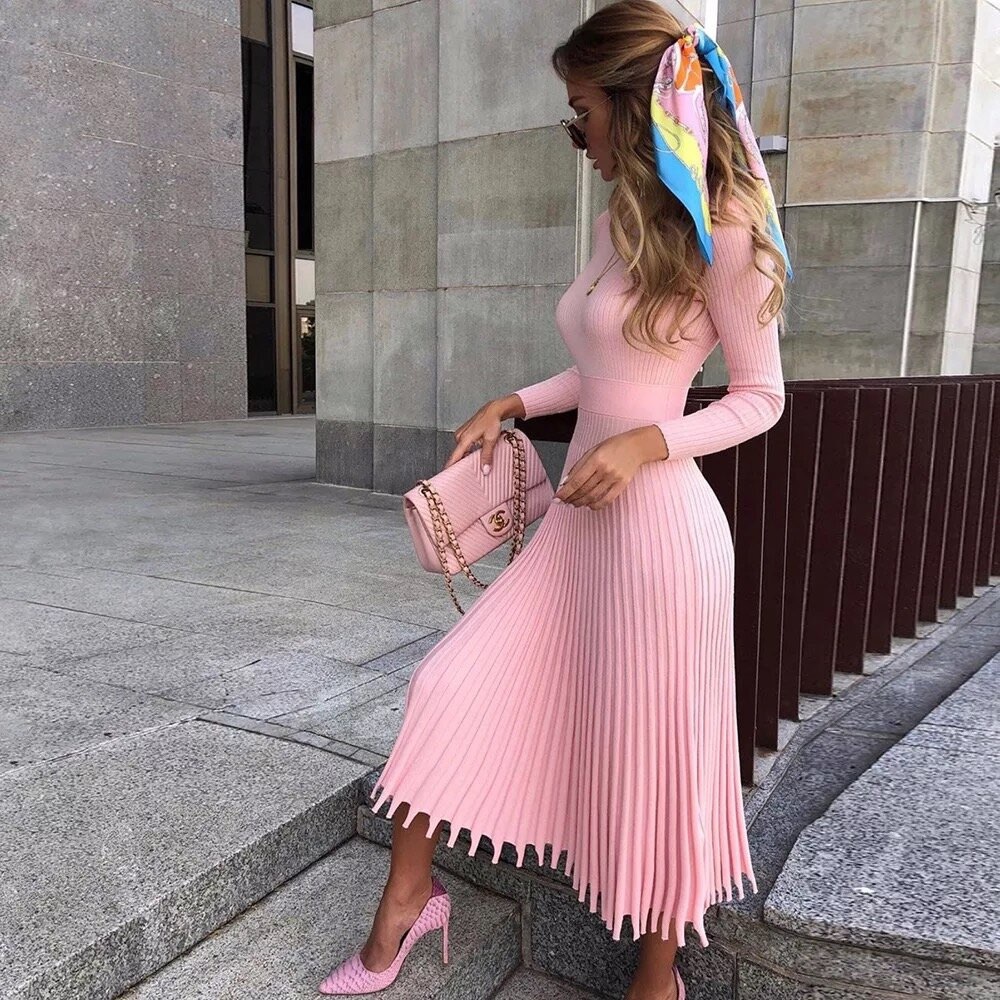 Pink long sleeve dress with frill hem.